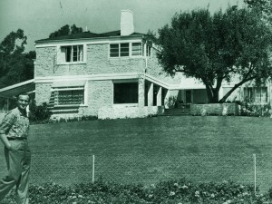 David Niven standing outside The Pink House, 1948