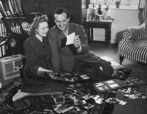 David Niven with his first wife, Primmie, looking through photos of his war years.