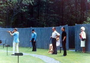 John F. Kennedy skeet shootiing, while HJotrdis watches from a safe distance. 30th May 1963