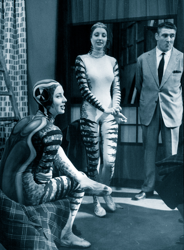 Pia and Mia Genberg in frog costumes, with actor / minder Lucien Fleurot. 1961