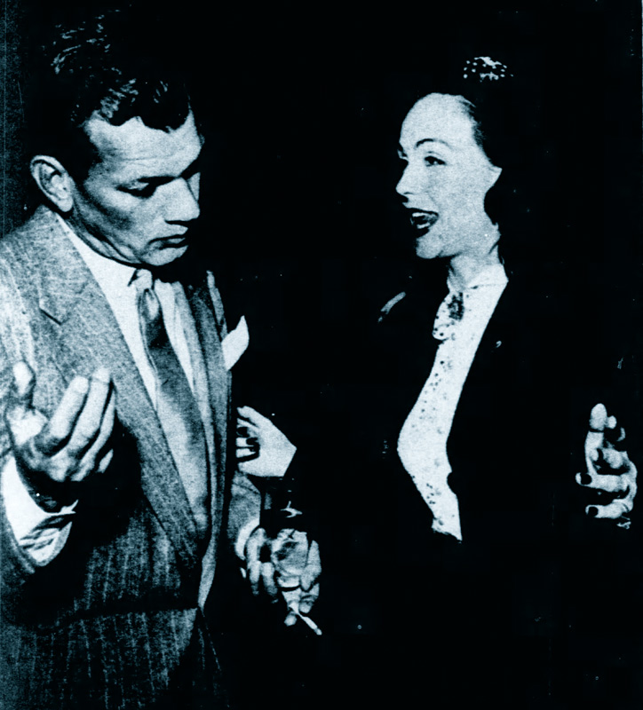 Joe Cotten shrugging along with Hjordis Niven. December 1950