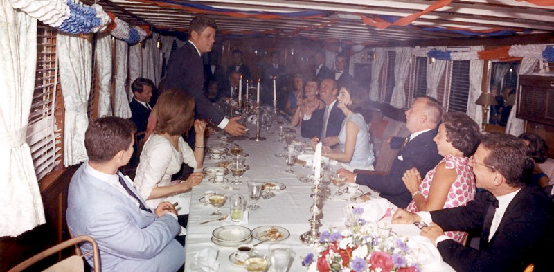 JFK's birthday party on The Sequoia. David Niven is sat opposite the president, beside The First Lady. 1963. No sign of Hjordis
