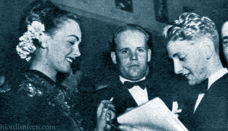 Hjordis Genberg with Carl Gustaf Tersmeden. Hjordis is being drawn by the cartoonist 'Mago'.