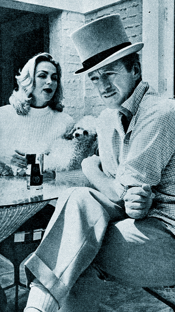 Blonde Hjordis Niven, with David in his top hat, 1956.