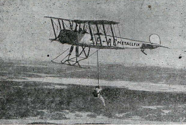 Parachutist A.Waldau demonstrating the strenth of Metallfix glue by hanging from a WW1-vintage aircarft with his parachute cord glued together with "Metallfix". 1932. Terrifying.